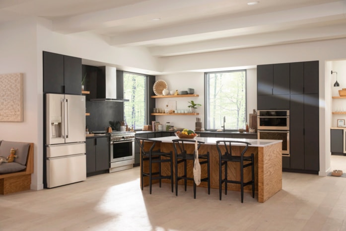 Open-plan kitchen with a built-in fridge, oven, and microwave.